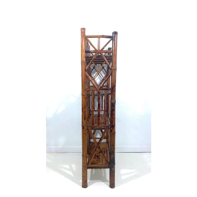 Versatile vintage shelf unit or book case made from 100% bamboo. Rich golden to dark brown and tan colours throughout with...