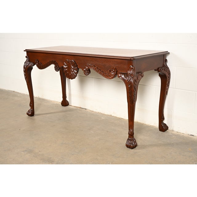 An exceptional Georgian or Chippendale style console table or sofa table By Baker Furniture USA, Circa 1980s Carved...