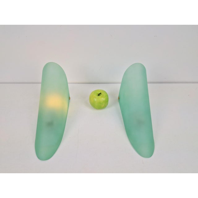 Pair of Minimalist Green Frosted Glass Triangular Conical Wall Sconce Lamp, 1990s Minimalist wall sconce made in Italy....