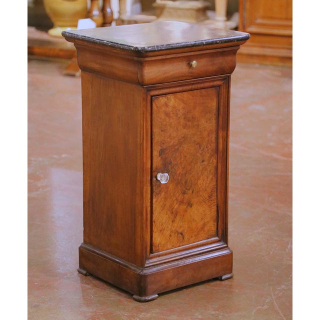 Crafted in France circa 1880, this elegant antique bedside cabinet reflects the restrained sophistication of the Louis...