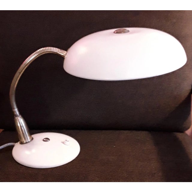 Fully adjustable Art Deco desk lamp in cream white metal with adjustable brass arm. European Plug (up to 250V).The wiring...