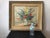 1950s oil on canvas painting of floral arrangement in a wood frame. Signed.