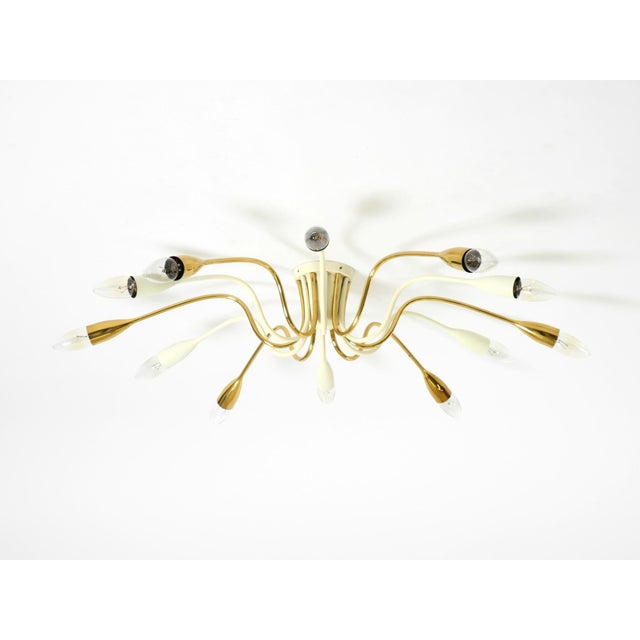 Original, very rare mid-century brass Sputnik ceiling lamp with 12 arms, attributed to Vereinigte Werkstätten. Beautiful...