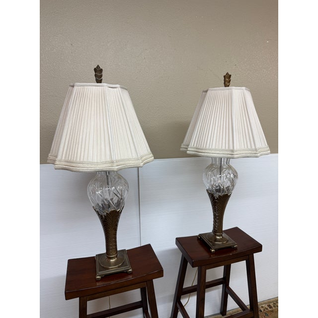 Design Plus Gallery presents a Pair of Art Deco Table Lamps. The lamps have a cast metal base in silver that resembles...