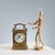 5-Jewel table clock with finely engraved and chiseled bronze mechanical movement. The front features a decoration of...