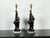 Two French pottery rooster table lamps from the mid 20th century, with dark patina and lucite bases. reated in France...