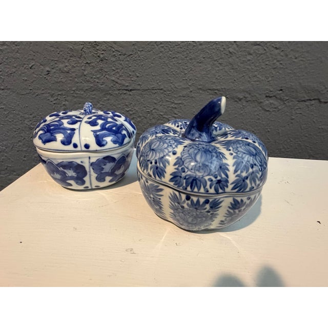 Handmade pair of blue and white Chinoiserie style pumpkin shaped porcelain boxes.