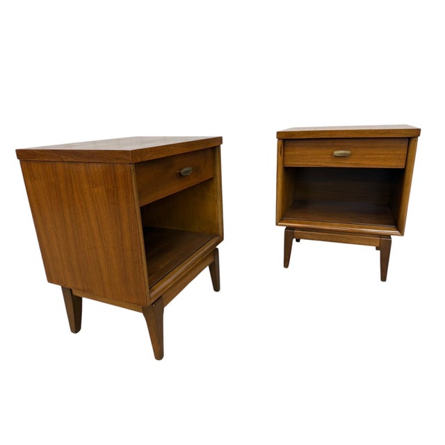 Add timeless style to your bedroom with this pair of Mid-Century Modern walnut nightstands. Featuring clean lines, warm...