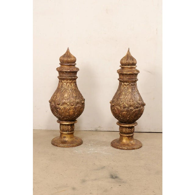 A French pair of large-sized, wood-carved pot à feu (fire urn) finials. This vintage pair of finials from France, each...
