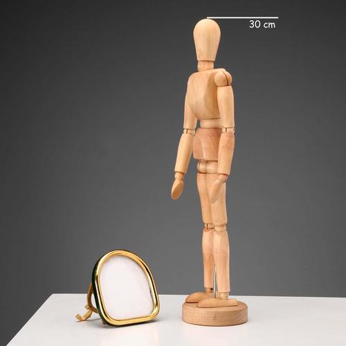 A freestanding photo frame in gilded brass with a green enamel band around the edge of the frame. The back features a...