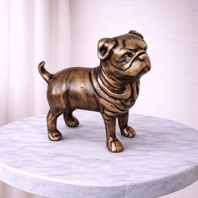 Enhance your home décor with this elegant antique-style pug dog sculpture, beautifully crafted from real metal and...