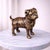 Enhance your home décor with this elegant antique-style pug dog sculpture, beautifully crafted from real metal and...