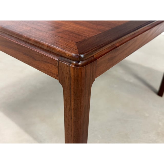 A mid century modern walnut side table or coffee table designed by Folke Ohlsson for DUX. Use as a small coffee table,...