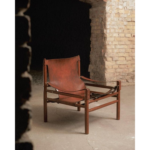 Buffalo Leather Safari Chair in the style of Arne Norell, 1970, in Good conditions. Designed 1970 to 1979 This piece is...