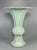 Hand-thrown Longquan celadon porcelain with a soft, luminous pale celadon glaze. The vase features elegant vertical...