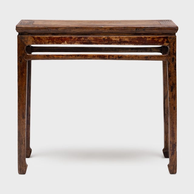 This narrow console table once resided in a 19th-century Chinese home, laden with food offerings and incense as a home...