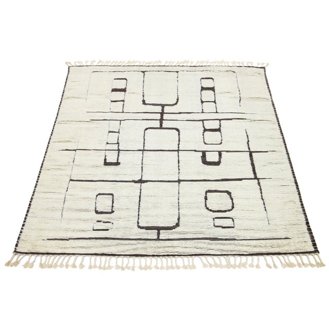 Beautiful Contemporary Moroccan-style hand-knotted wool rug with an ivory and gray field in a stunning geometric design....