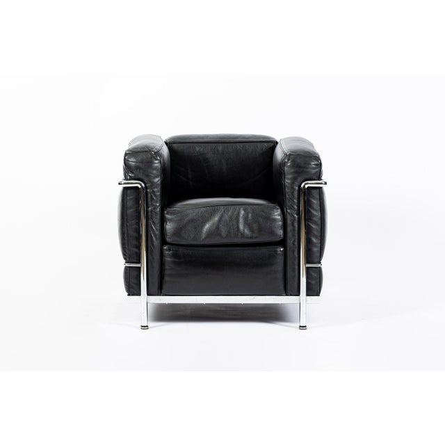 This authentic LC2 Petit Modele black leather armchair originally designed by Le Corbusier, Charlotte Perriand and Pierre...