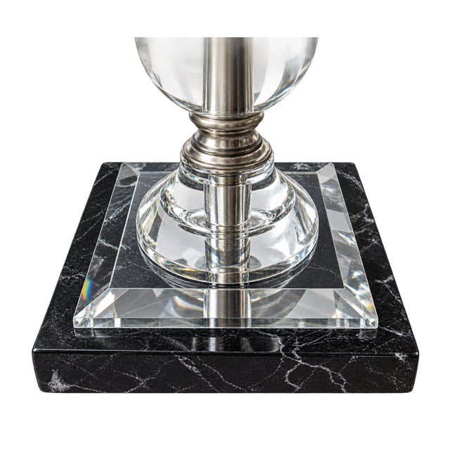 Elegant and sophisticated table lamp featuring a striking column of five clear crystal orbs accented with polished silver-...