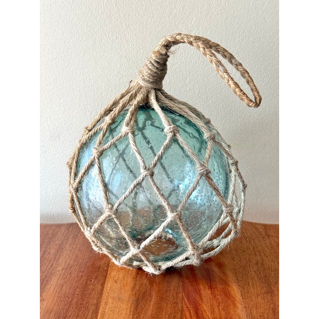 Authentic handblown glass fishing float buoy in beautiful coastal blue-green color. Unsure of origin and original glass...