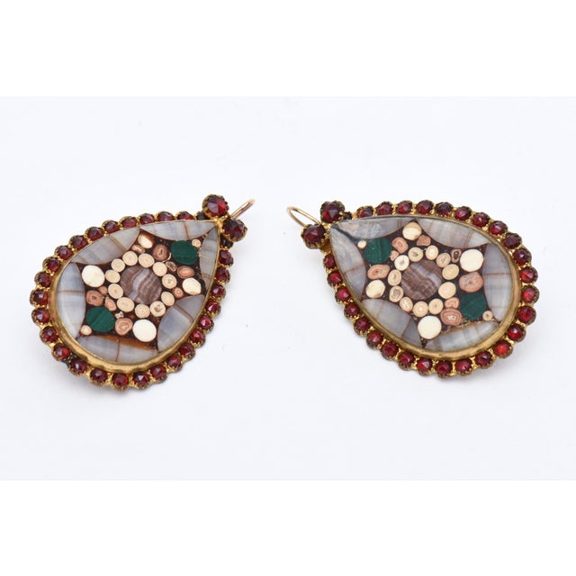 These mid century modern pair of Scottish dangle pierced earrings have a 3 dimensional flower like design inlay of mixed...