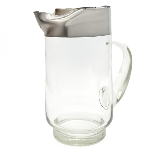 Original vintage Dorothy Thorpe silver band glass pitcher, a true embodiment of Mid-Century Modern elegance, likely...