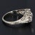 Here is an Antique 19k White Gold Filigree Design Ring with Three Diamonds, The Center Stone Weighs ~0.50cts & The Two...