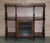 Very fine circa 1880 Burr walnut with Marquetry inlay, brass gallery rail and original porcelain castors, open library...