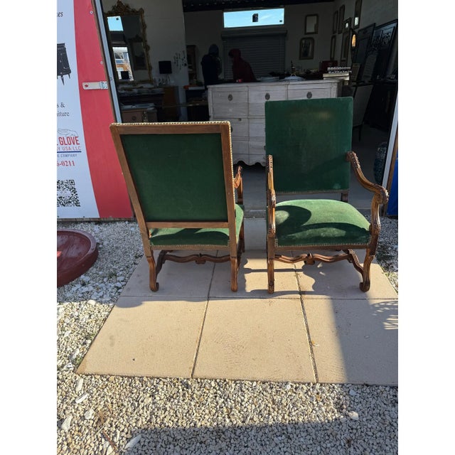 Large Pair of French Louis XIII Armchairs from France made of solid walnut, the wood has been finished with a lustrous...