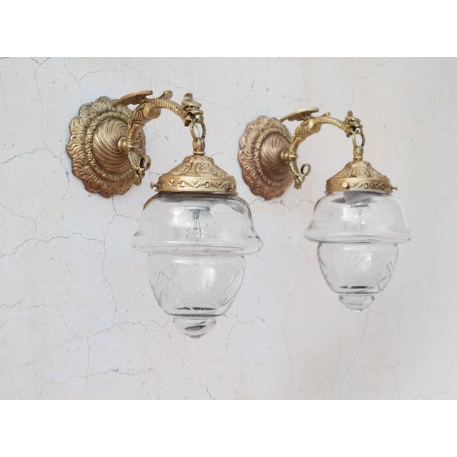Spectacular and Exceptionally Rare Set of Four (4) 1950s Spanish Empire Style Cast Brass Wall Sconces with Heavy Artisan...