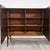 Vintage Scandinavian highboard made in Denmark , displaying a rich and expressive wood grain. The cabinet combines...