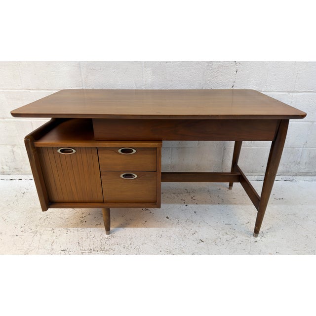 This mid-century modern style executive desk features four dovetail-jointed drawers floating atop elegant, brass-foot...