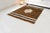 This is a vintage Turkish Oushak rug from the Mid 20th Century. The piece was hand-knotted.