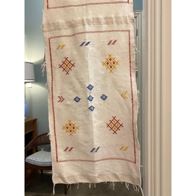 This is a really fun Moroccan embroidered table runner. This runner is made from cactus silk creating the neutral canvas...