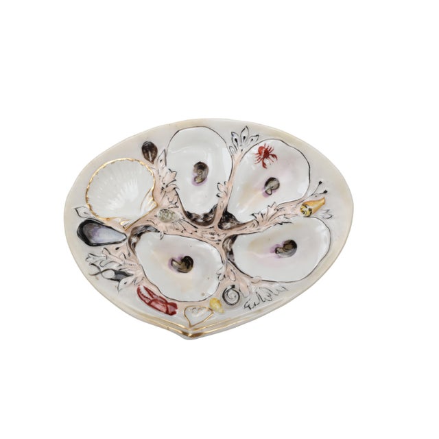 Stunning antique oyster plate by Union Porcelain Works in an elegant white porcelain featuring four oyster wells and a...