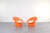 This set of two orange lounge chairs „Skopa” model was designed in the 1970s by renowned Danish designers Ole Gjerløv-...