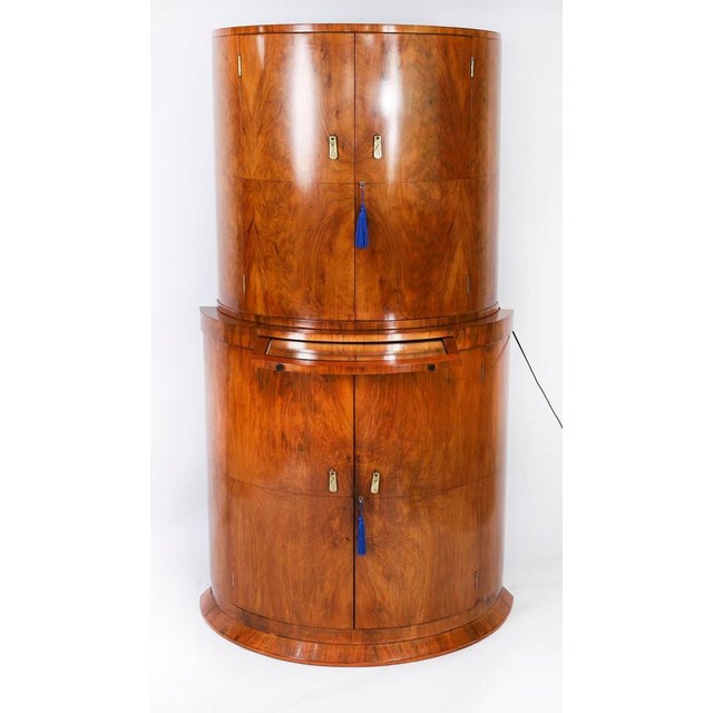This is a fantastic antique Art Deco burr walnut demi lune cocktail cabinet by the cabinet makers Hille, renowned for high...