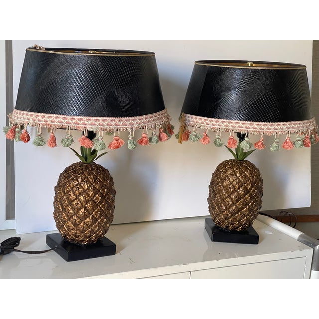 Pair of vintage pineapple lamps with embossed leather like shades with fringes. Tropical, safari style design accent.