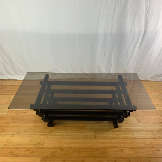 Vintage tubular metal coffee table with original smoked glass top. Made in the 1970s.