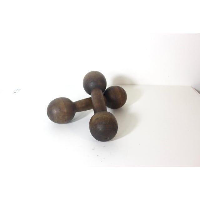Vintage set of two wooden hand weights or dumbbells. These have great patina, some scratches nicks and wear, as shown in...