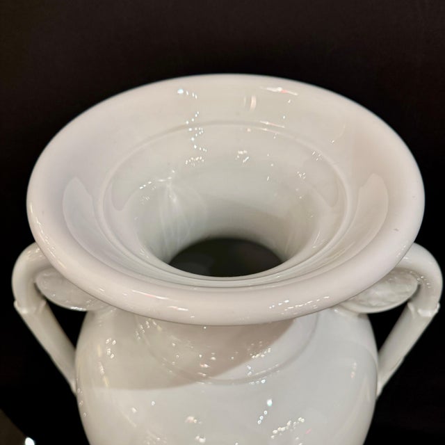 A tall KPM Neoclassical Amphora vase in white porcelain from the Royal Porcelain Manufactory in Berlin, Germany....