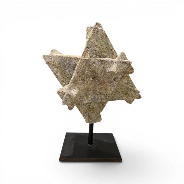 A striking example of 18th century French decorative artistry, this carved stone star polyhedra features a sculptural...