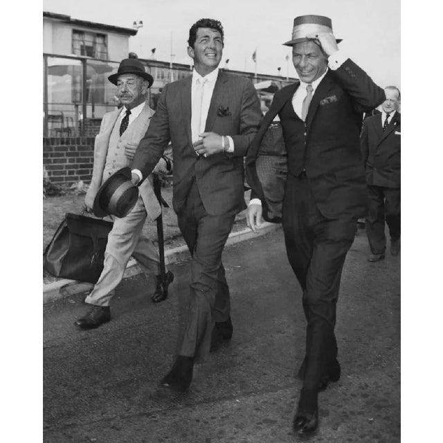 "Martin And Sinatra" by J Wilds American singers and actors Dean Martin (1917 - 1995) (centre) and Frank Sinatra (right)...
