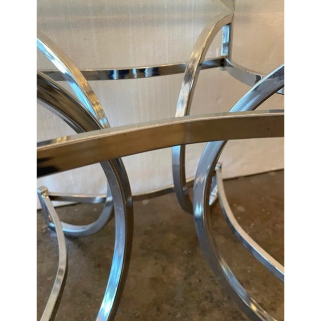 Pair of mid century modern chrome side end tables with glass tops.