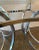 Pair of mid century modern chrome side end tables with glass tops.