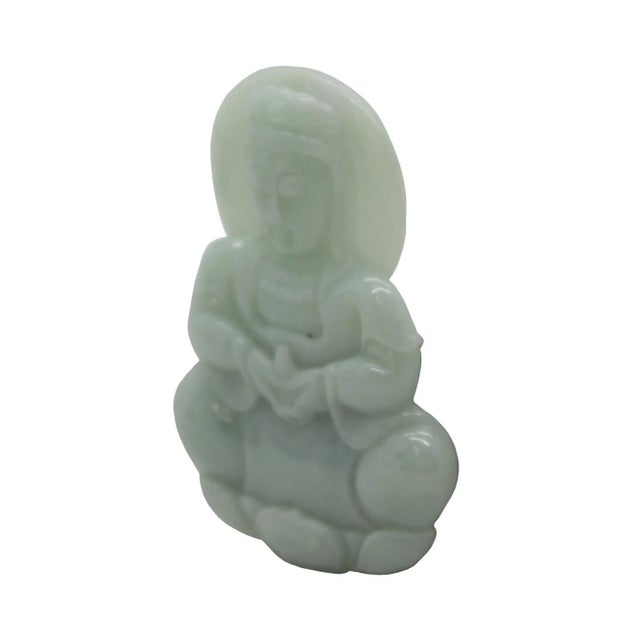 This beautiful pendant is carved from natural untreated jade, the motif of this pendant is a Kwan Yin meditate sitting on...