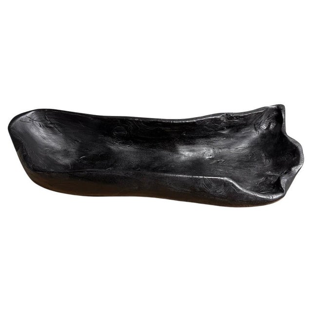 Impressive long charred vessel hand carved from a single piece of reclaimed teak wood. Both usable and sculptural. Charred...