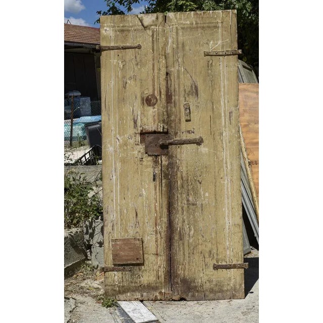 Double-leaf door, solid wood, framed with 4 panels with traces of lacquer and fillets. Italian, 16th/17th century, to be...