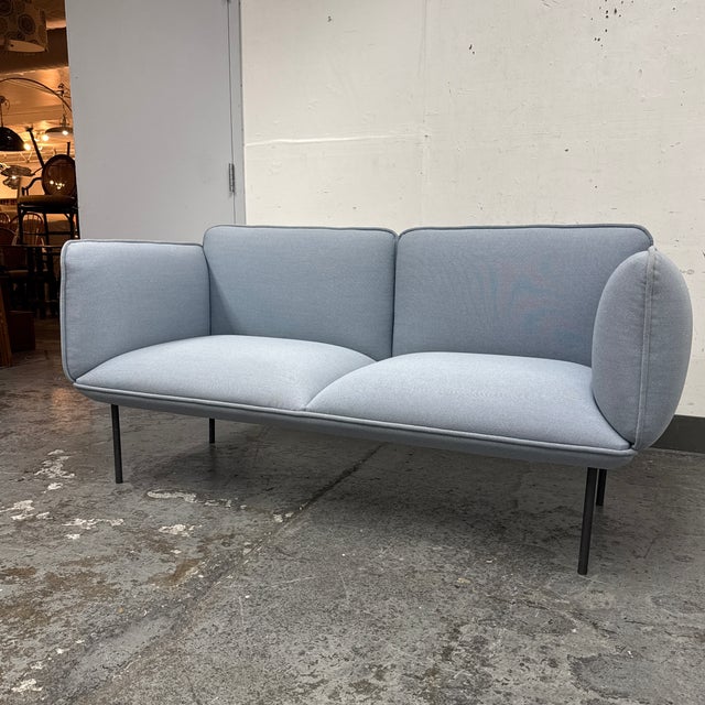 Design Plus Gallery presents the Nakki Two-Seater Sofa by Mika Tolvanen for WOUD. This two-seat sofa has a modern form...