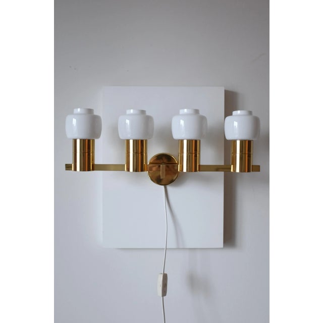 Stunning Vintage Wall Lamp Model V-306/4 by Hans-Agne Jakobsson for his eponymous light firm in Sweden. This piece have 4...